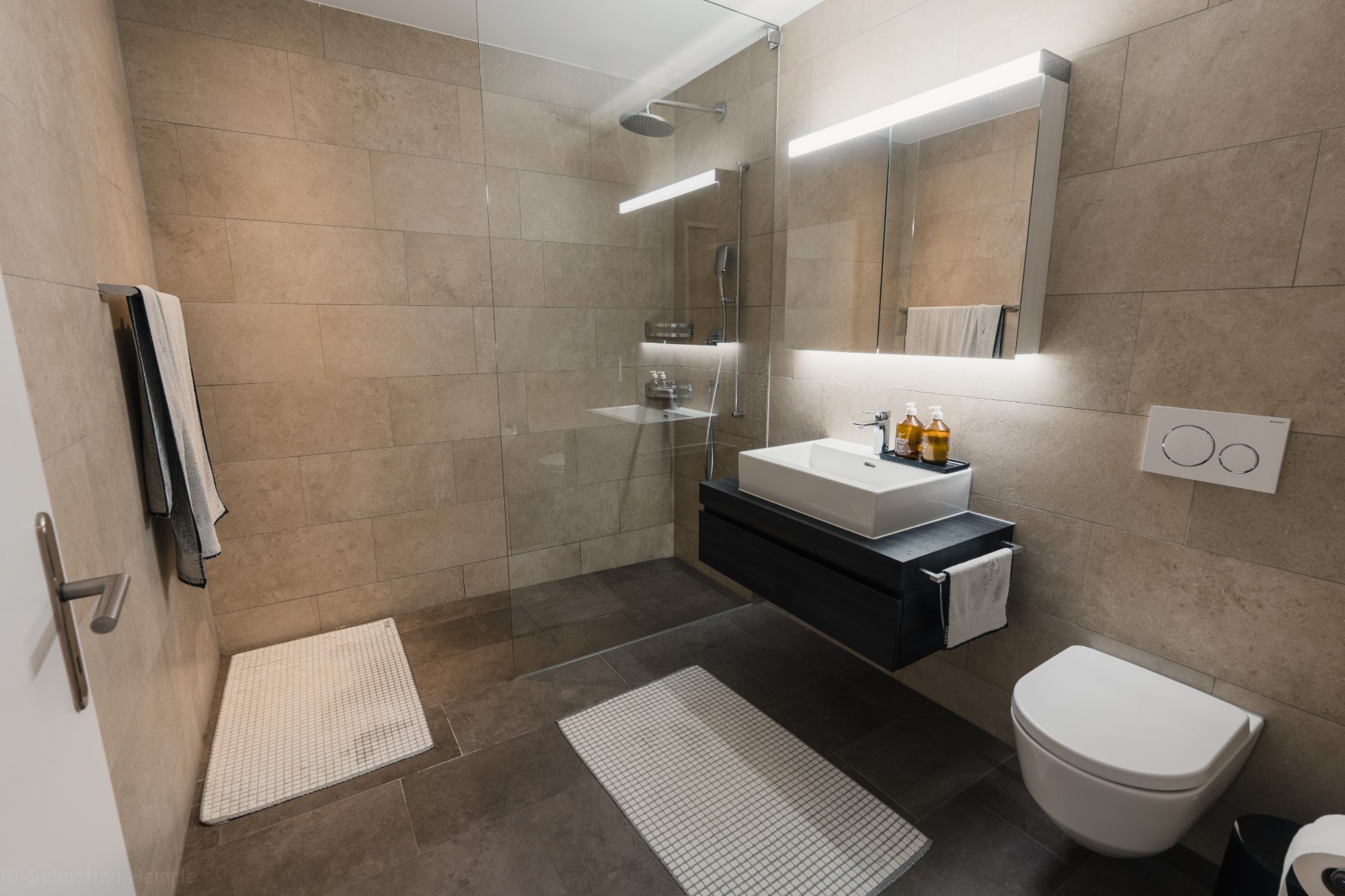 Bathroom with walk-in shower and floating vanity