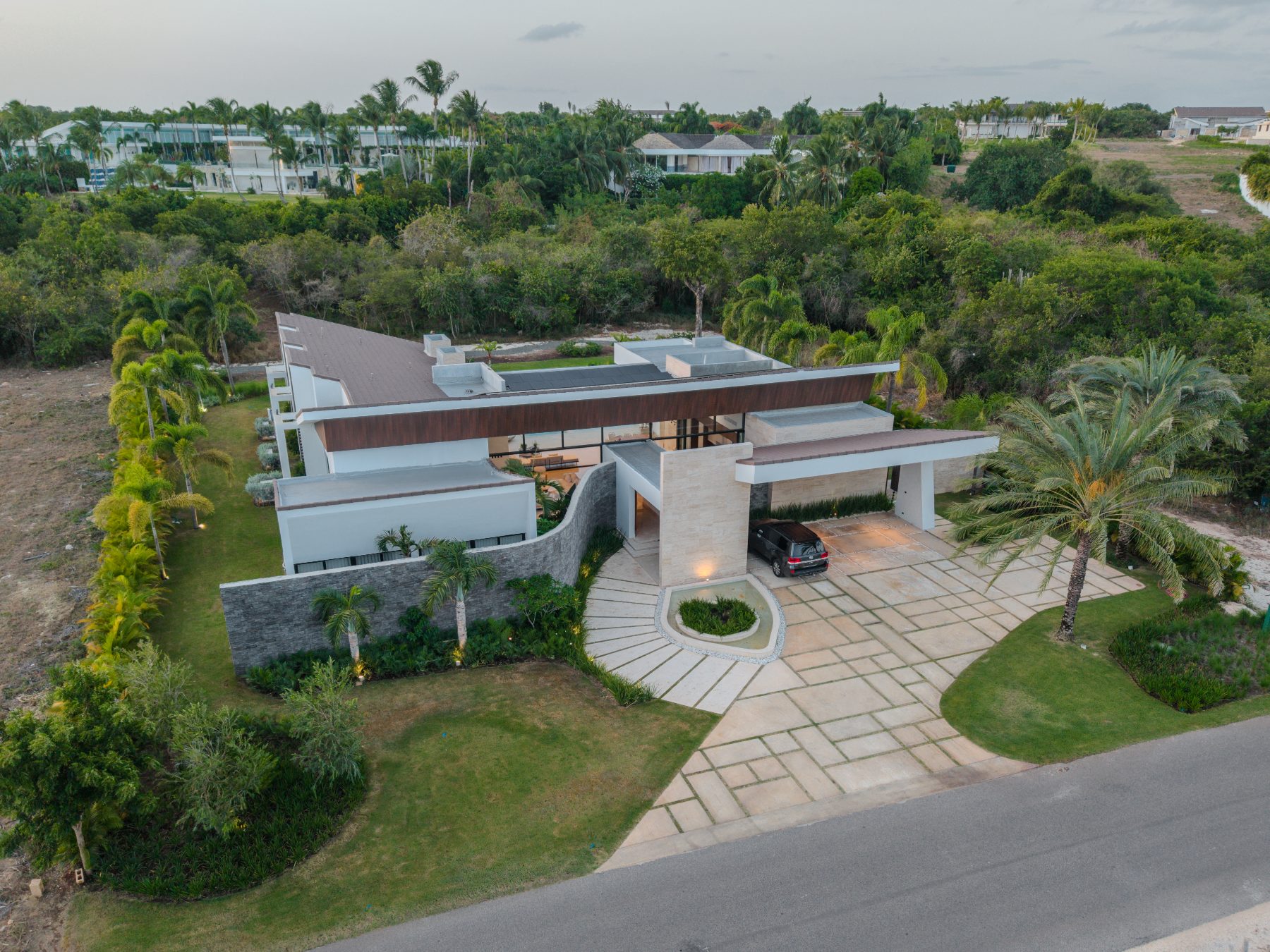 Aerial view of the villa, its courtyard roofline and arrival court